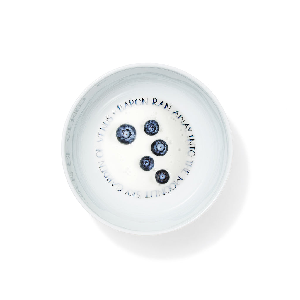 Handmade porcelain breakfast bowl from The First Supper collection filled with milk