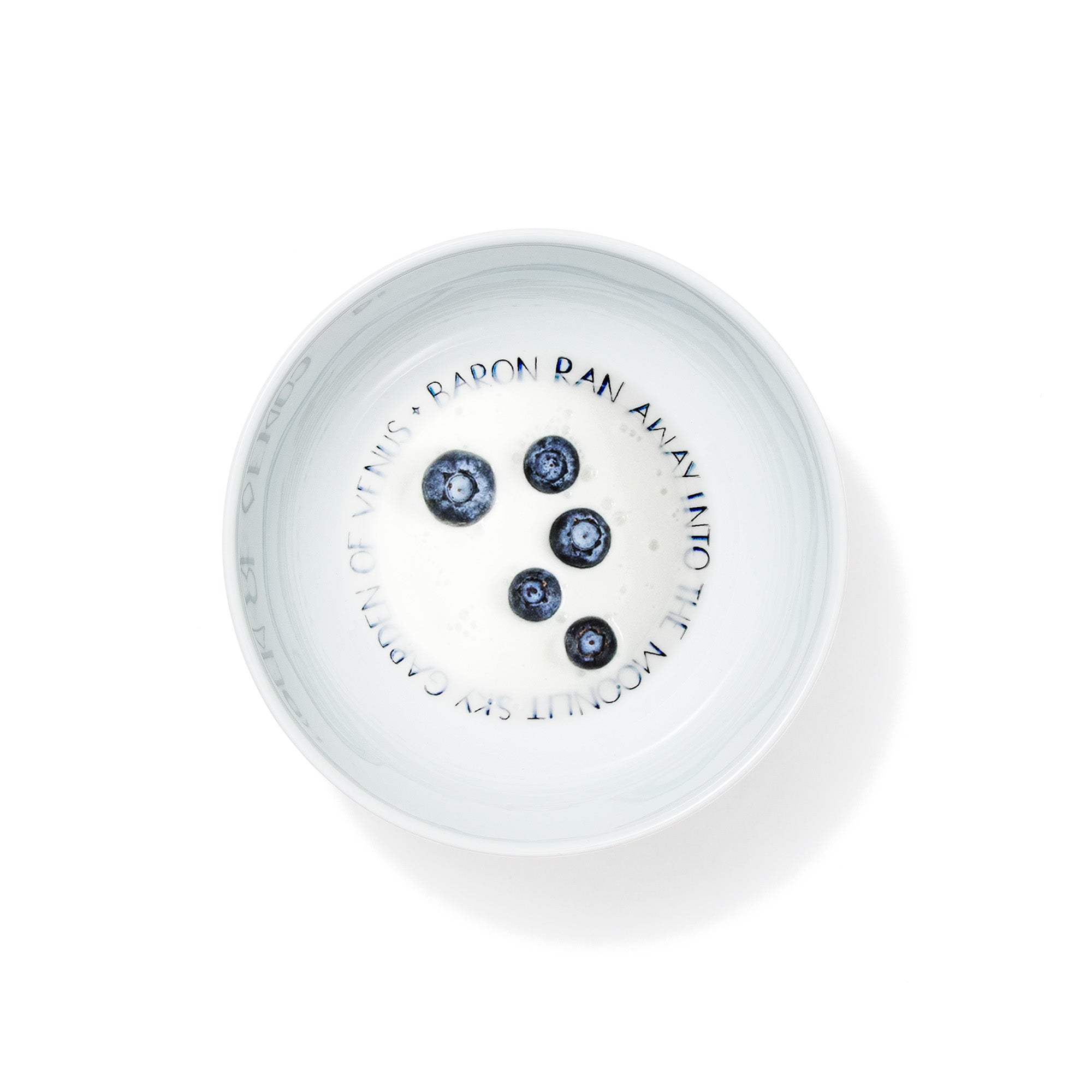 Handmade porcelain breakfast bowl from The First Supper collection filled with milk