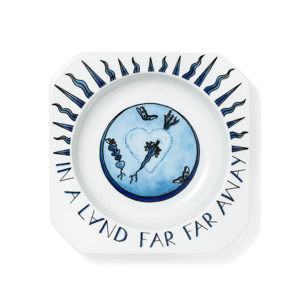 cobalt blue china with a hand illustrated sun 